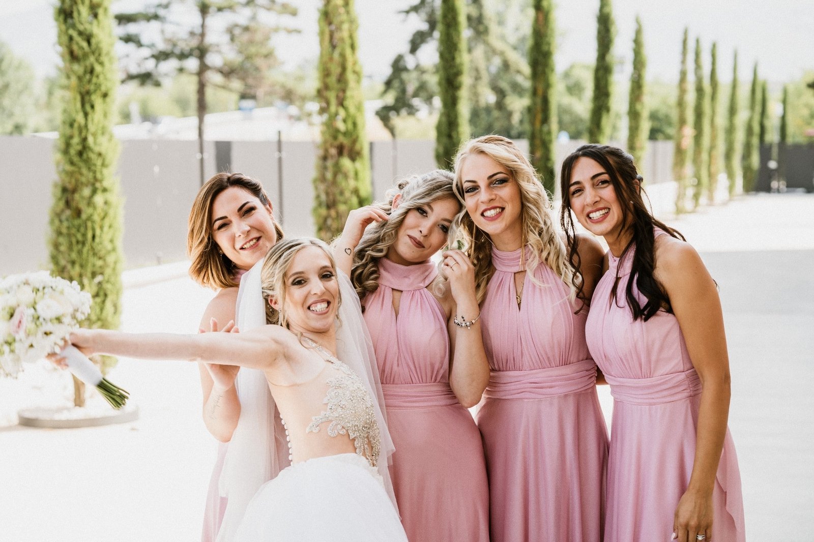 happy smiling bride with her brides maids