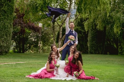 bride and groom in the garden with their brides maids