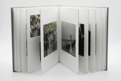 a standing photography wedding album showing open pages